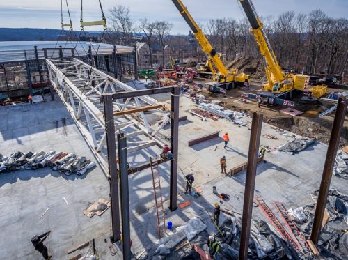 Cranes Lowering Steel Frames